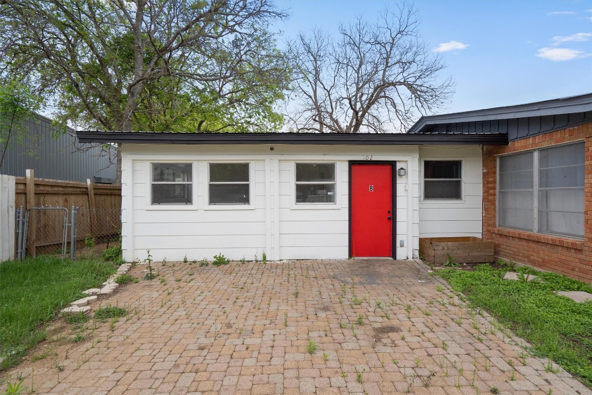10205 Old Manchaca Road, Unit B Austin, TX 78748 - Photo 2 of 24 a backyard of a house with seating space