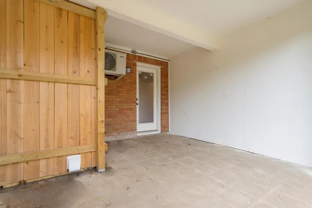 an empty room with a wooden door