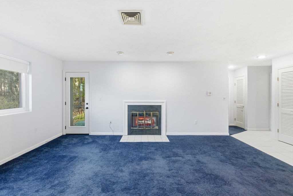 9 Thomas Street, Unit C11 Saugus, MA 01906 - Photo 11 of 42 an empty room with entrance and window