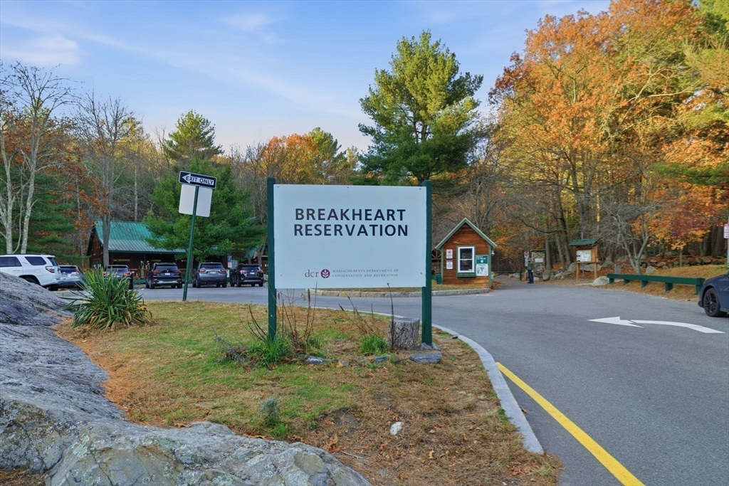 9 Thomas Street, Unit C11 Saugus, MA 01906 - Photo 29 of 42 a view of a street sign under a large tree