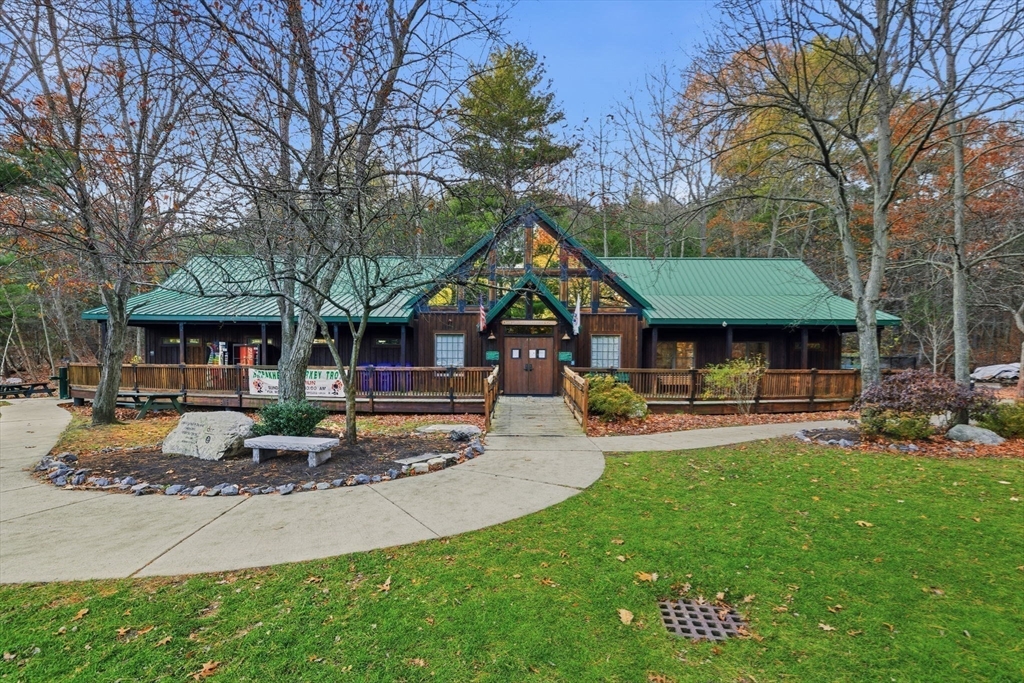 9 Thomas Street, Unit C11 Saugus, MA 01906 - Photo 30 of 42 a front view of a house with garden and sitting area