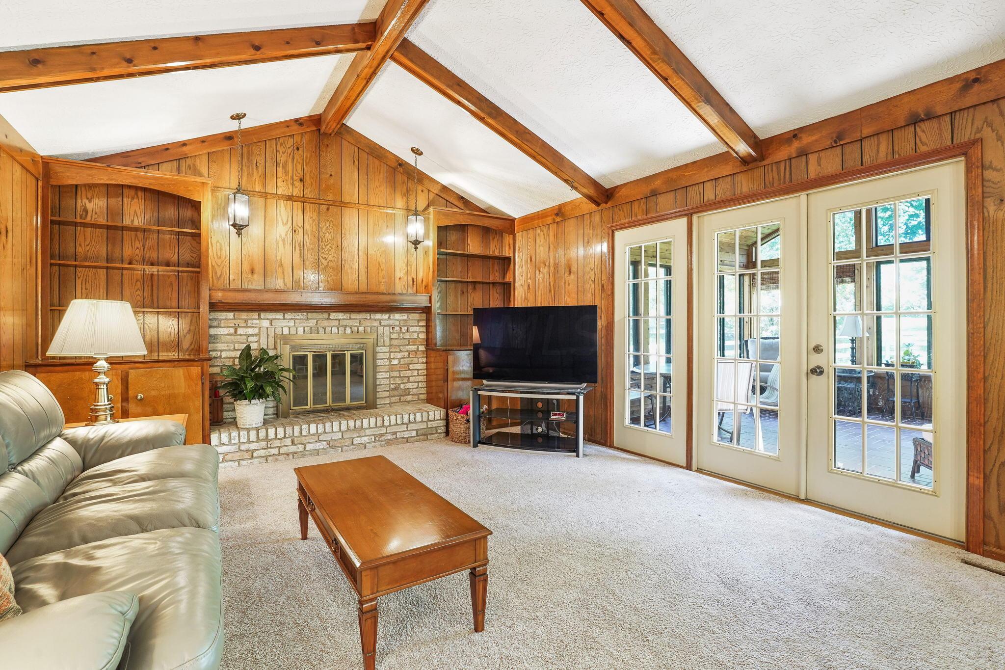 1180 Chatham Ridge Road Westerville, OH 43081 - Photo 39 of 69 Large family room with fireplace with beamed vaulted ceilings
