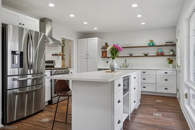 a kitchen with cabinets a sink and stainless steel appliances
