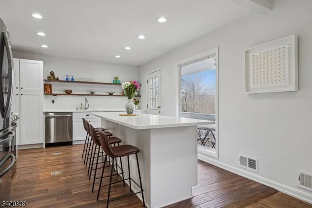 a kitchen with a table and chairs in it