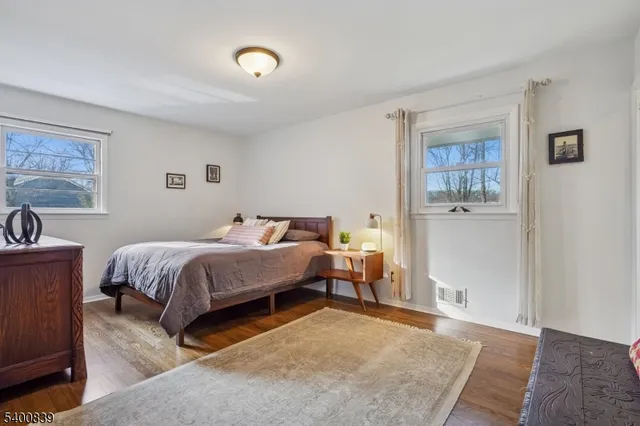 a bedroom with a bed and a table in it