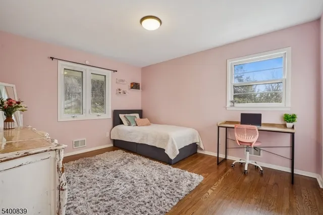 a bedroom with a bed and a table in it