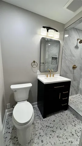 a car parked in front of house with trees