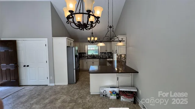a view of kitchen island with cabinets
