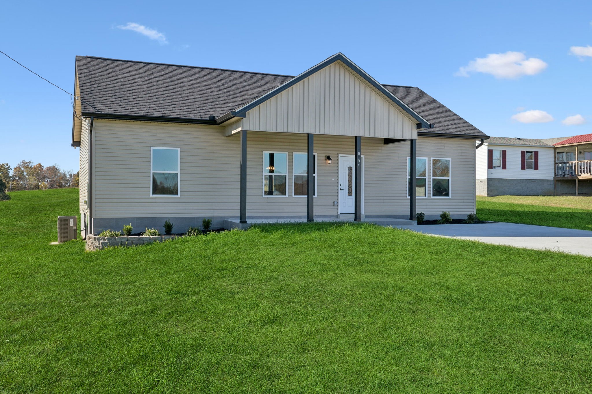 10154 Rocky Point Road Bon Aqua, TN 37025 - Photo 2 of 26 a view of a house with backyard