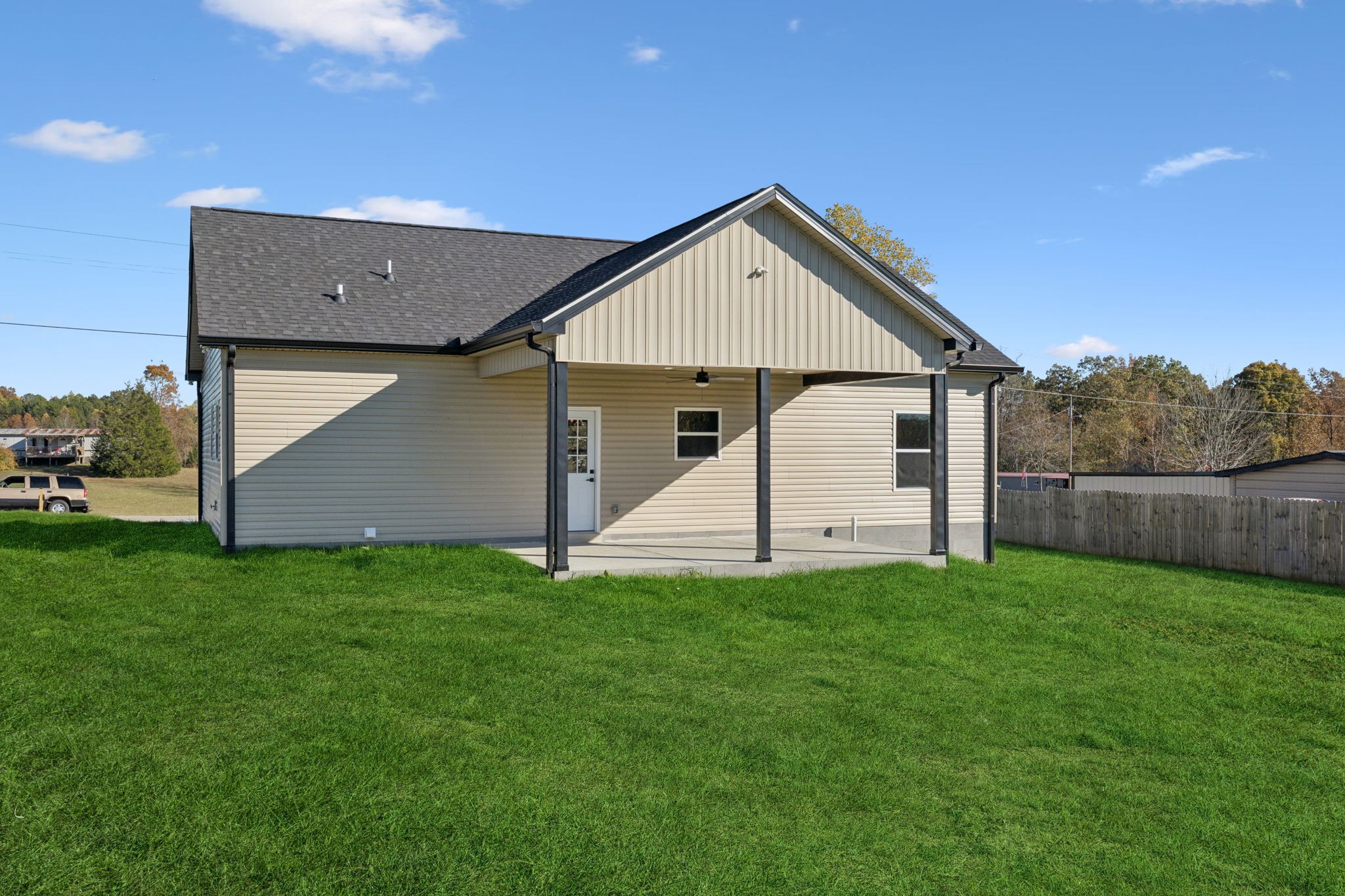 10154 Rocky Point Road Bon Aqua, TN 37025 - Photo 24 of 26 a view of a house with a yard