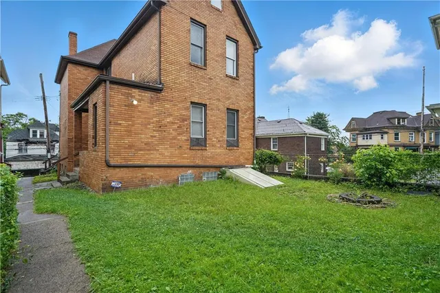 a view of a back yard of the house