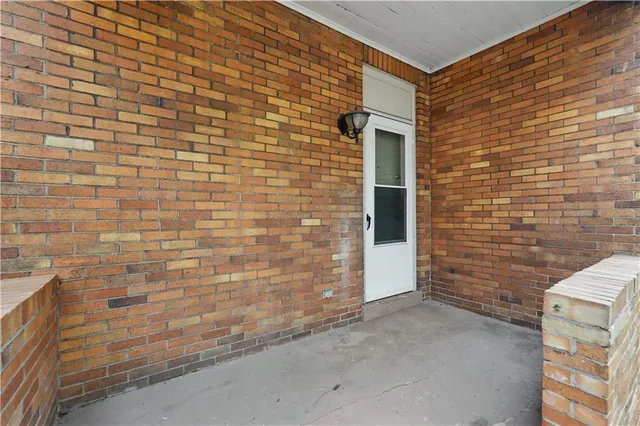 a brick house with a brick wall