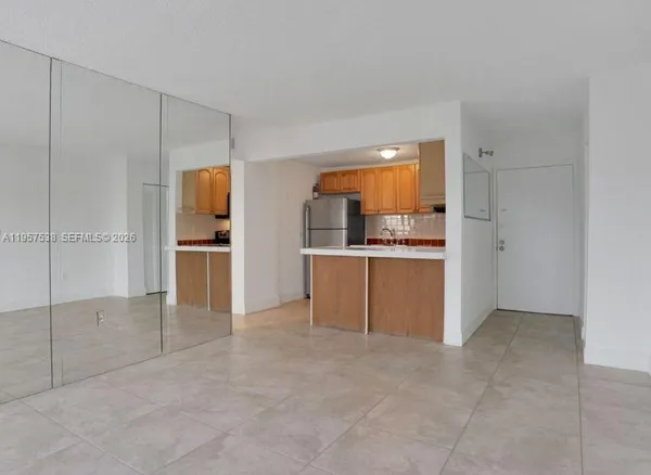 a kitchen with stainless steel appliances a refrigerator and a sink