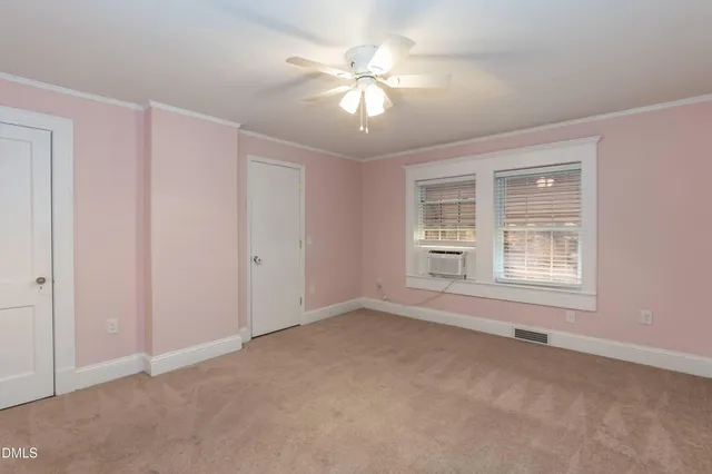 a view of a house with a yard and garage