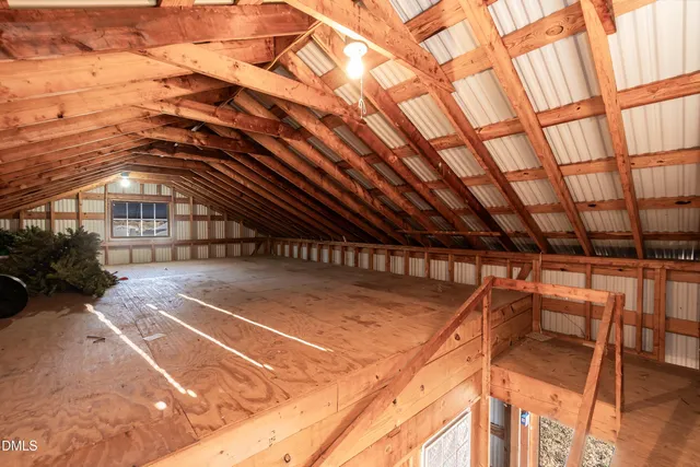 a view of a house with a yard and garage