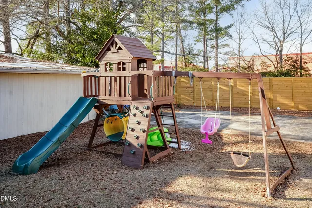 a view of a backyard with a sitting area
