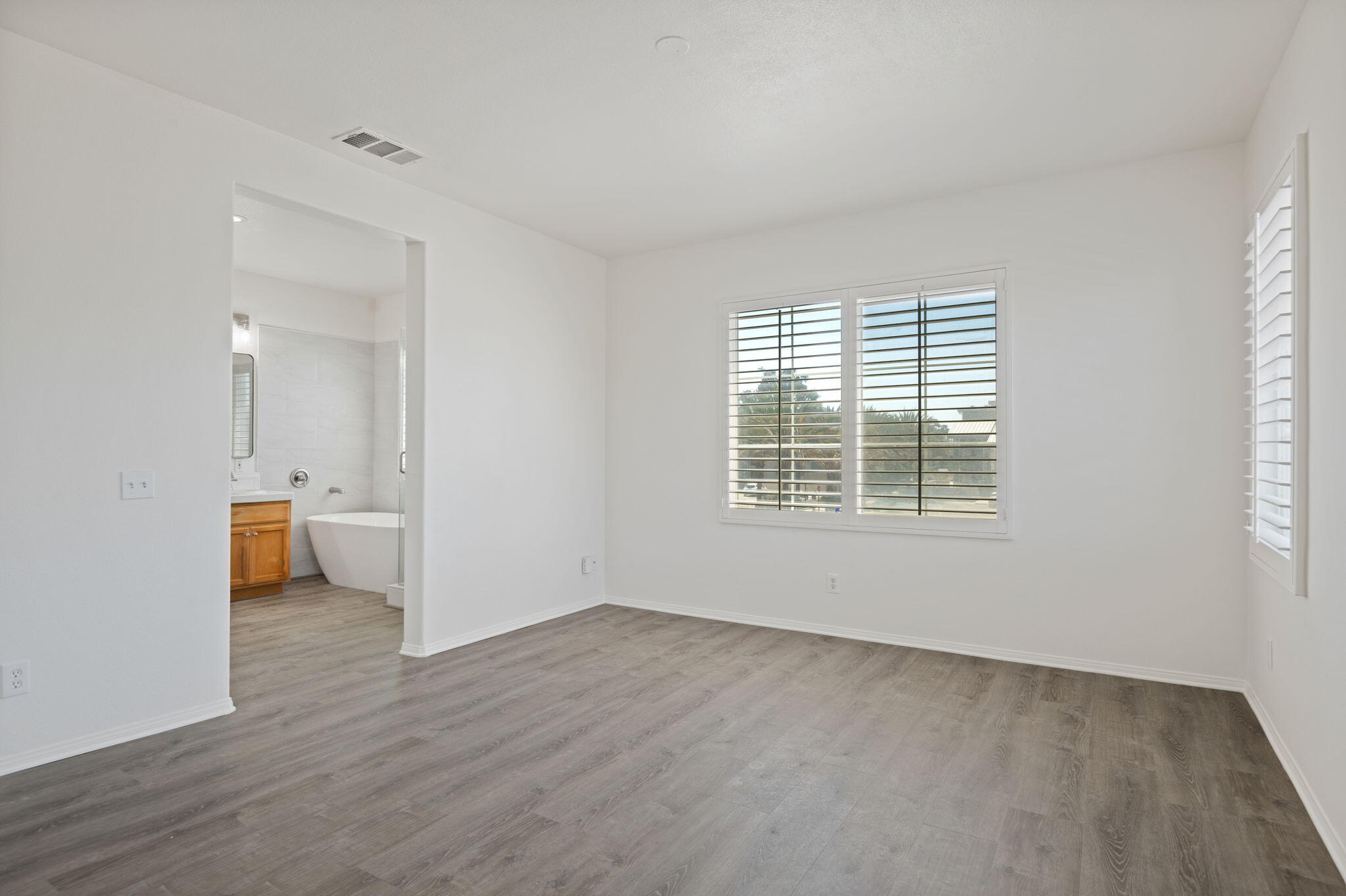 541 Sweet Rain Place Goleta, CA 93117 - Photo 16 of 40 an empty room with wooden floor and windows