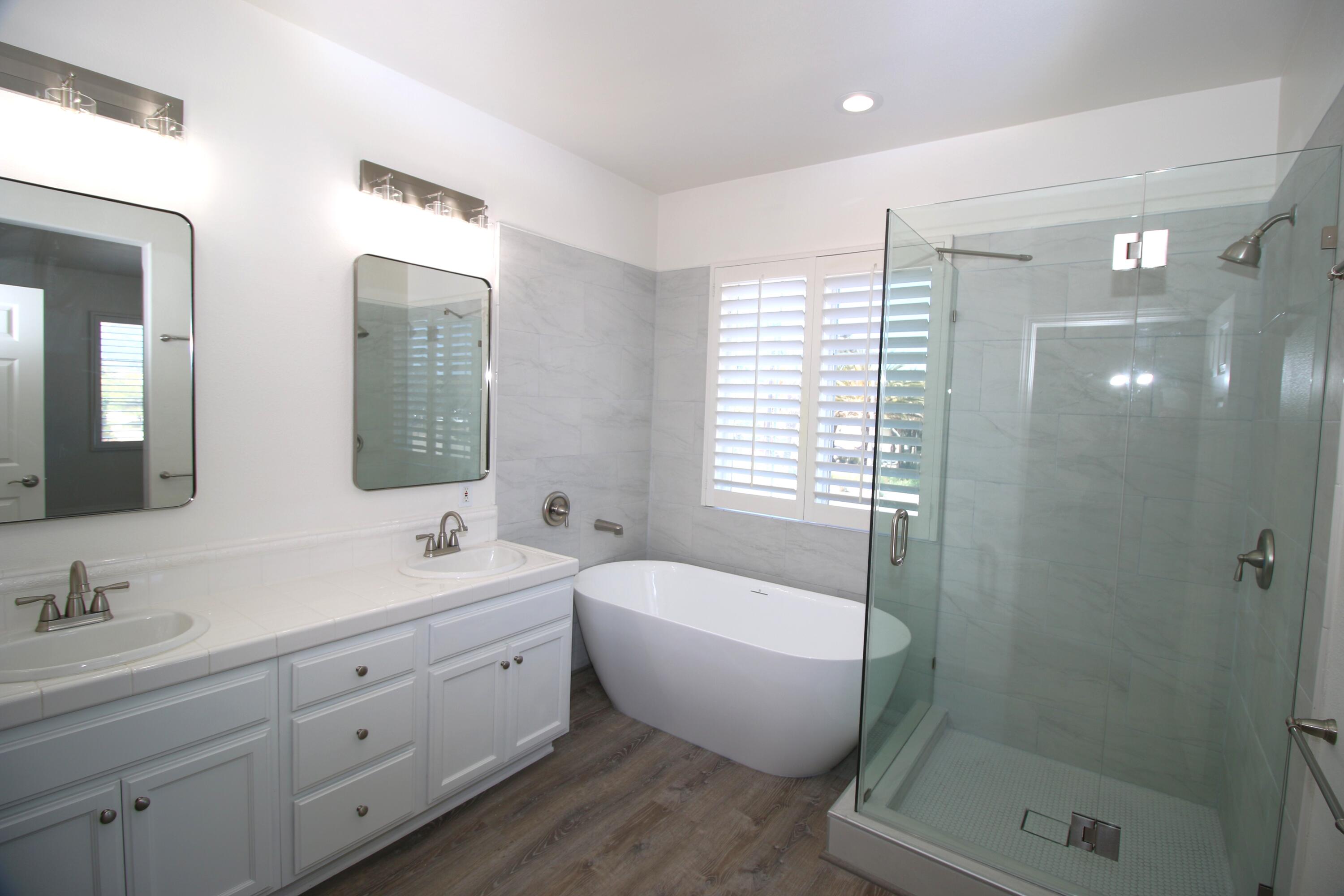 541 Sweet Rain Place Goleta, CA 93117 - Photo 17 of 40 a spacious bathroom with a double vanity sink mirror and bathtub
