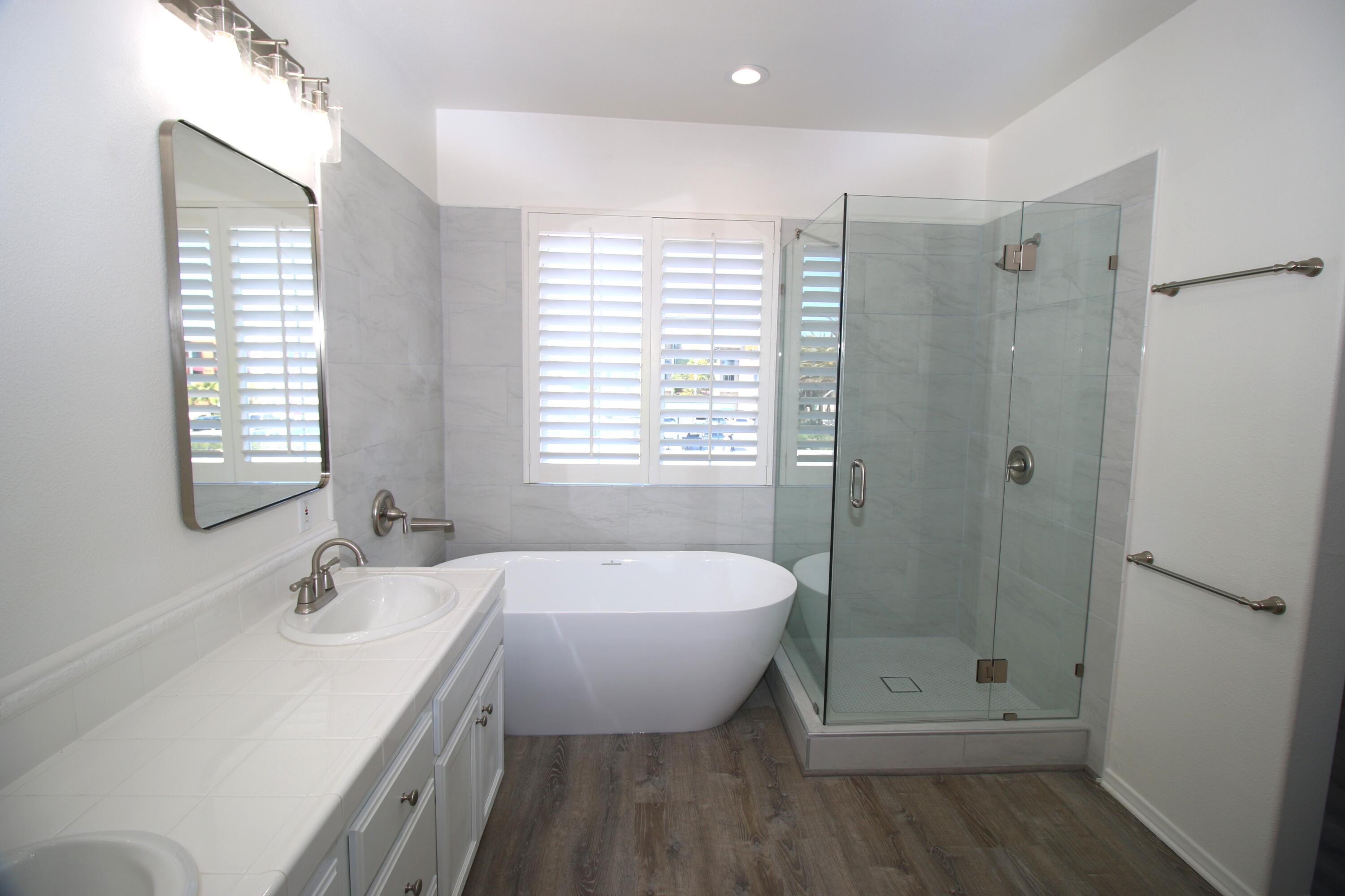 541 Sweet Rain Place Goleta, CA 93117 - Photo 18 of 40 a bathroom with a granite countertop sink a toilet and shower
