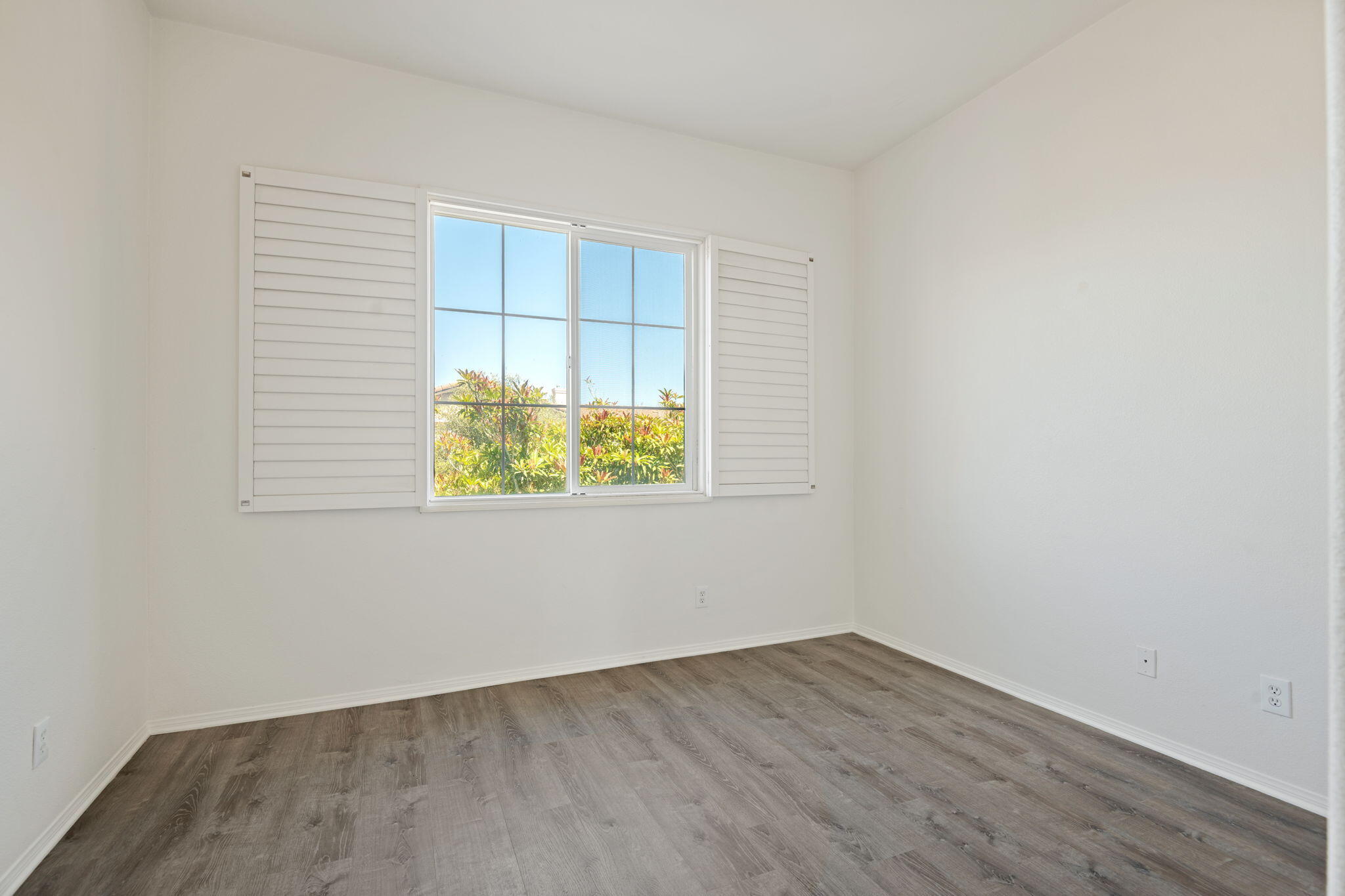 541 Sweet Rain Place Goleta, CA 93117 - Photo 19 of 40 an empty room with wooden floor and windows