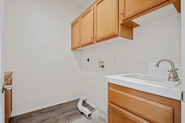 a view of a storage and utility room with sink