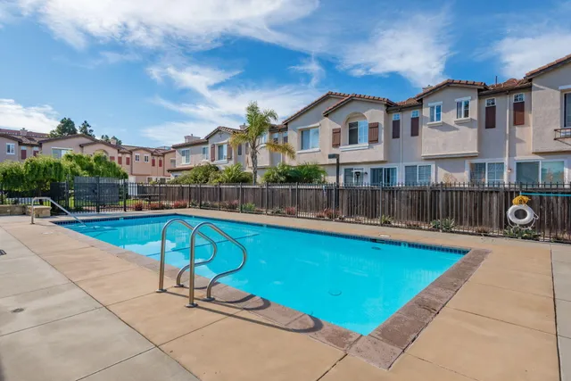 a view of a swimming pool with a lounge chairs