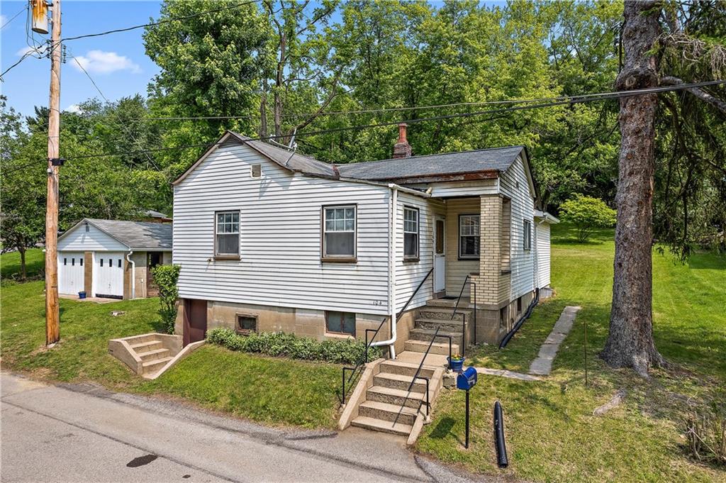 front view of house with a yard