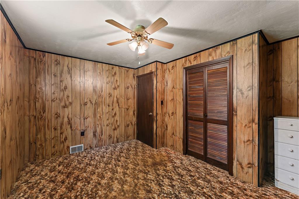 104 W Road Pittsburgh, PA 15209 - Photo 14 of 40 a view of a hallway with closet and a chandelier fan