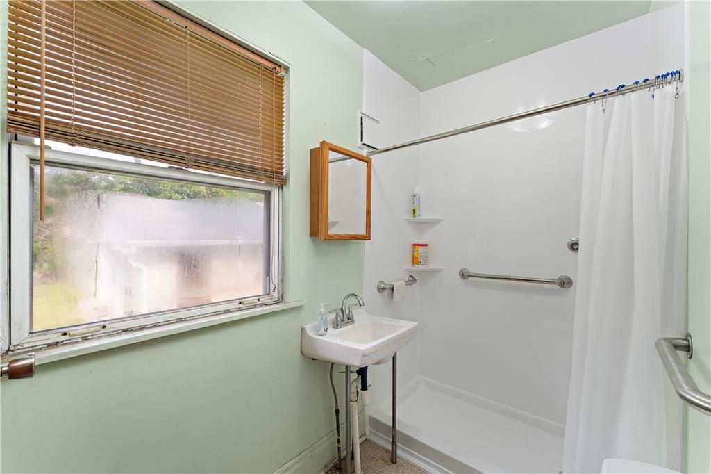 104 W Road Pittsburgh, PA 15209 - Photo 22 of 40 a bathroom with a sink and a mirror