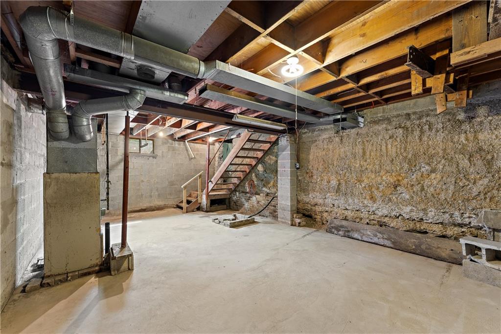 104 W Road Pittsburgh, PA 15209 - Photo 31 of 40 a view of an empty room with wooden walls