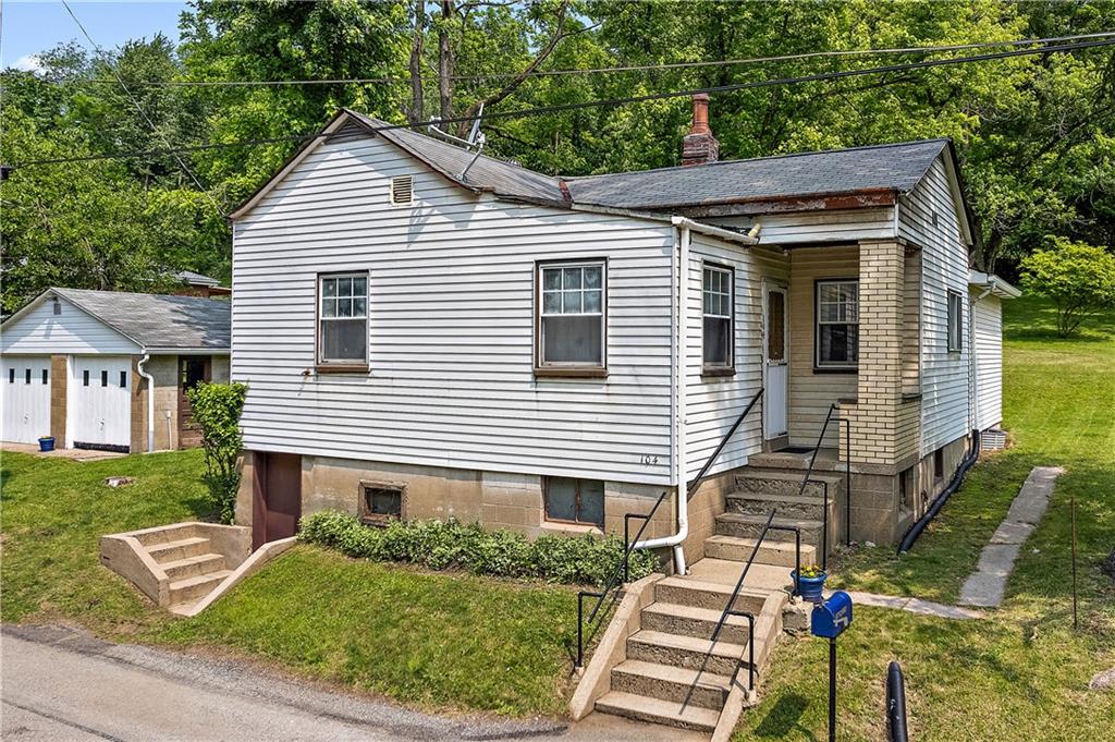 104 W Road Pittsburgh, PA 15209 - Photo 36 of 40 a front view of a house with a yard