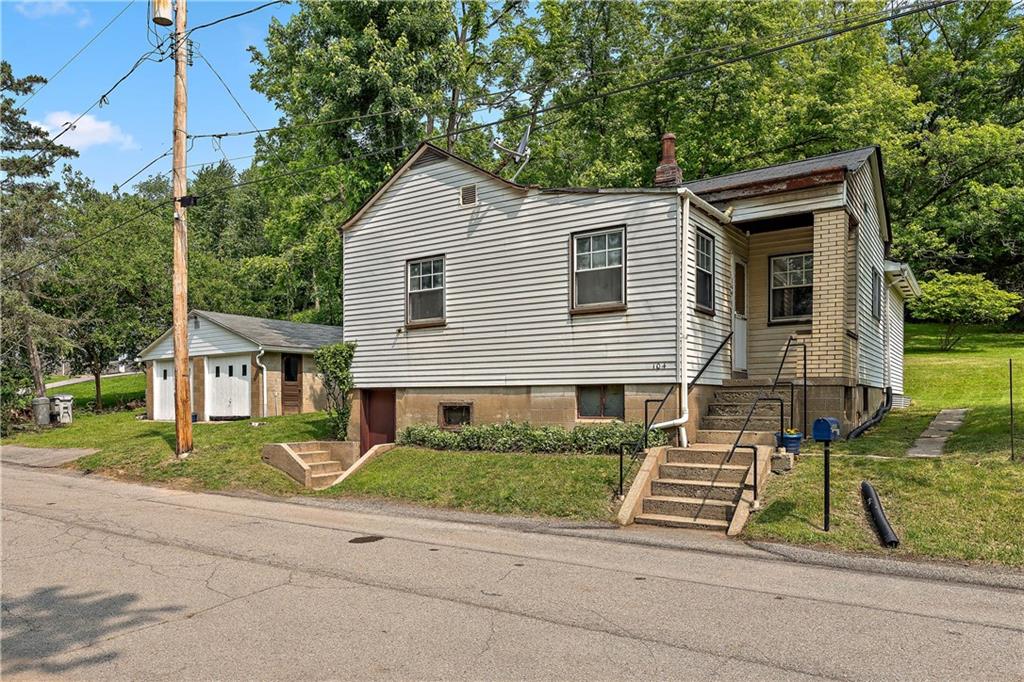 104 W Road Pittsburgh, PA 15209 - Photo 37 of 40 front view of house with a yard