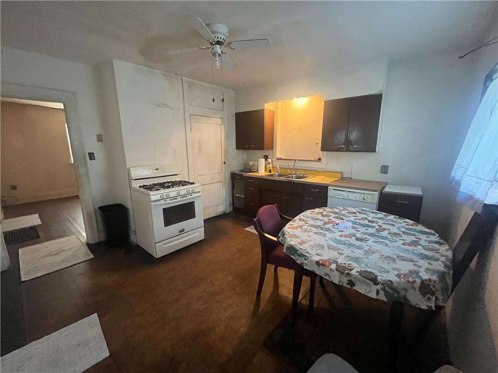 104 W Road Pittsburgh, PA 15209 - Photo 6 of 40 a kitchen with a table chairs refrigerator and microwave