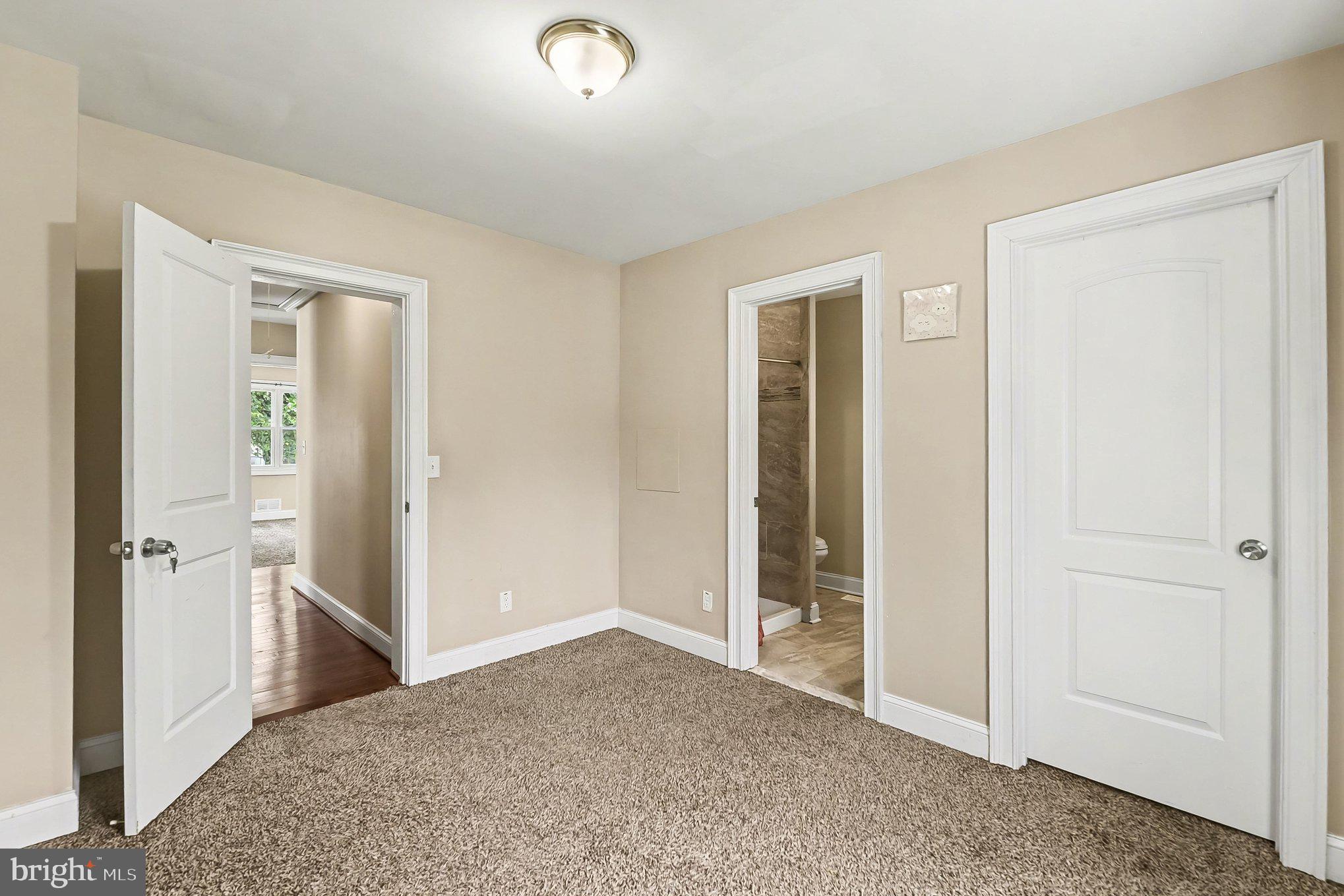 8716 Eddington Road Parkville, MD 21234 - Photo 11 of 27 an empty room with windows