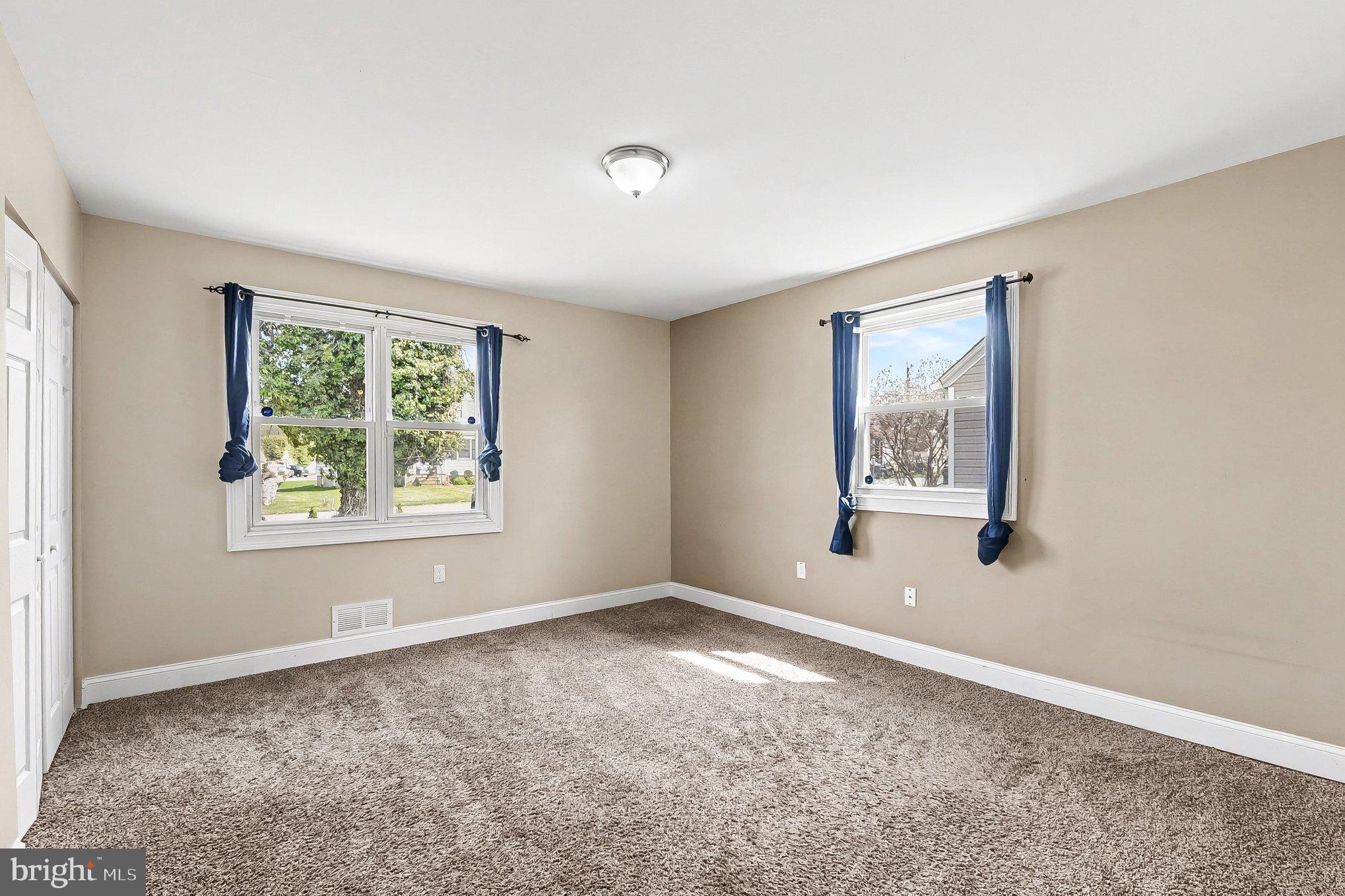 8716 Eddington Road Parkville, MD 21234 - Photo 13 of 27 a view of empty room with window