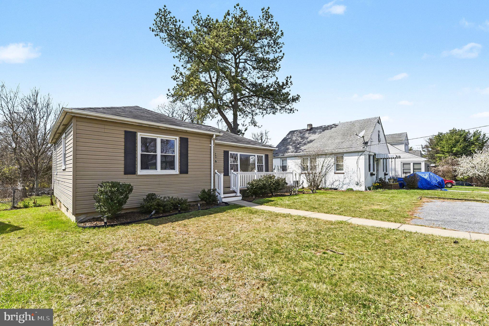 8716 Eddington Road Parkville, MD 21234 - Photo 17 of 27 a front view of a house with a yard