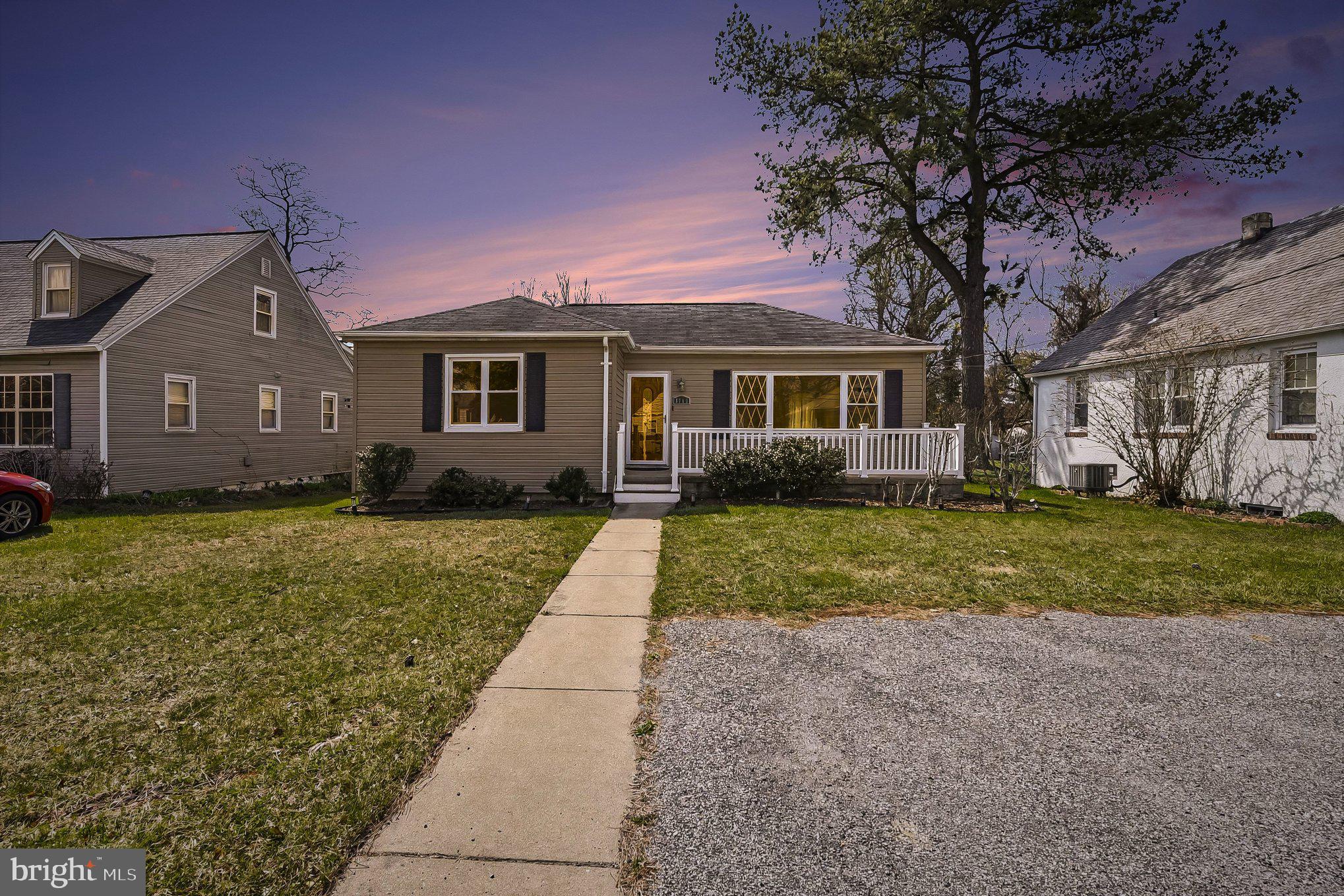 8716 Eddington Road Parkville, MD 21234 - Photo 2 of 27 a front view of house with yard and green space