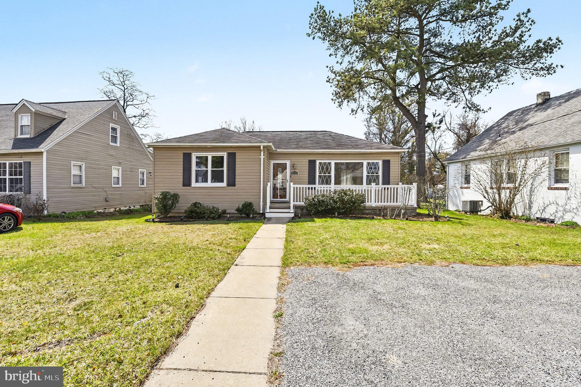 8716 Eddington Road Parkville, MD 21234 - Photo 3 of 27 a front view of a house with a yard