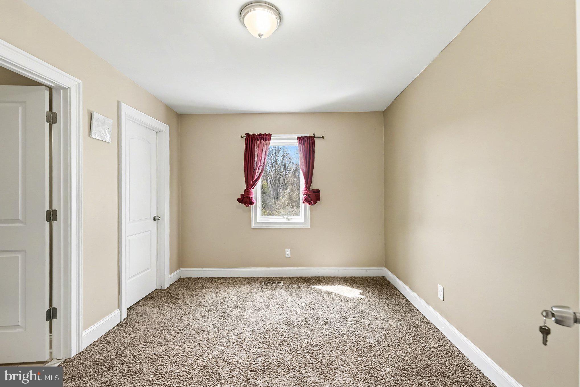 8716 Eddington Road Parkville, MD 21234 - Photo 10 of 27 a view of a room with window