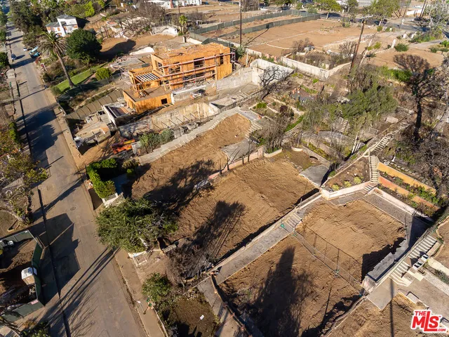 an aerial view of residential house with parking space