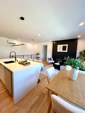 a kitchen with a sink and a refrigerator