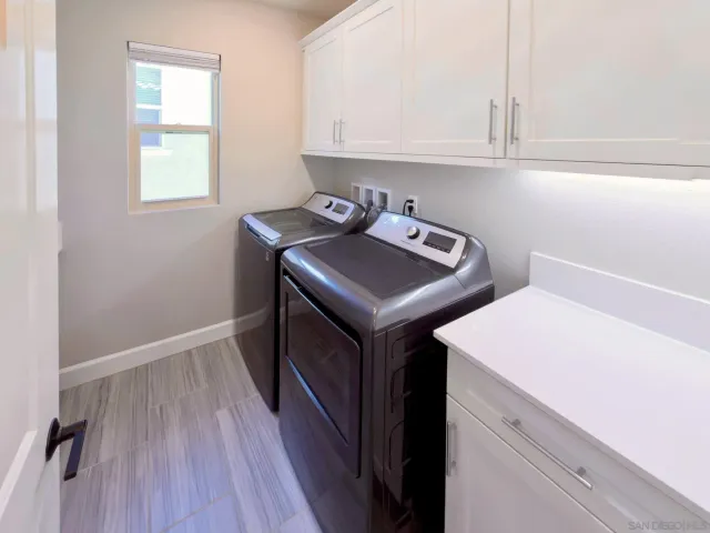 a utility room with washer and dryer