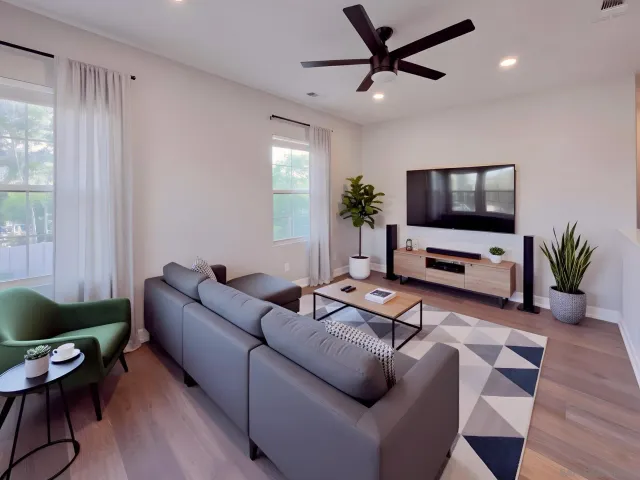 a living room with furniture and a flat screen tv