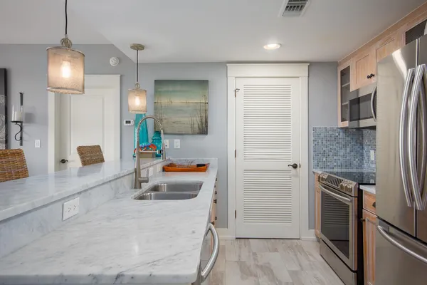 a bathroom with a double vanity sink a bathtub and shower