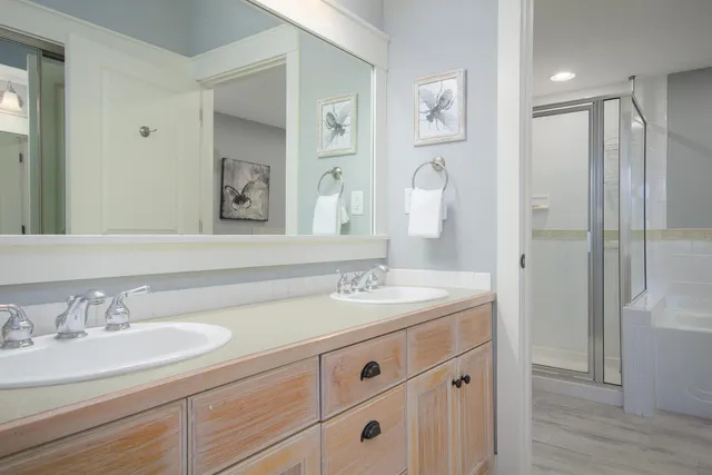 a bathroom with a granite countertop sink mirror and double
