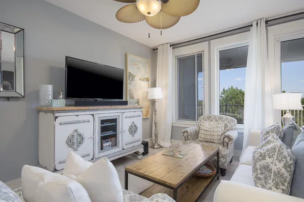 a living room with furniture and a flat screen tv