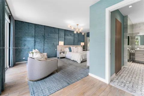 a bed room with furniture and a chandelier