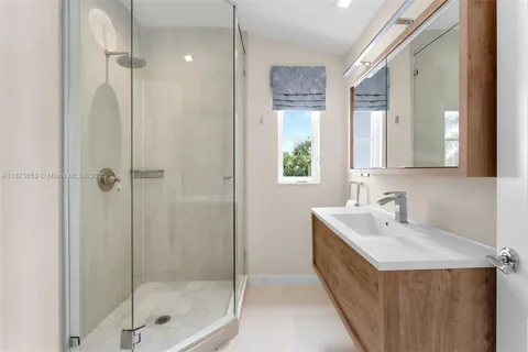 a bed room with a bed and a chandelier