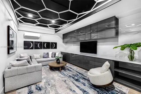 a living room with furniture or couch and a potted plant