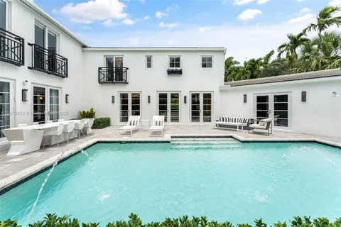 a view of a swimming pool with a yard